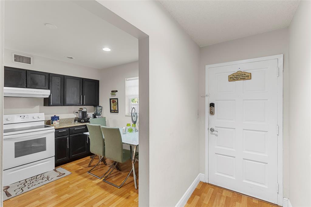 7556 Stirling Road, Unit 222 Hollywood, FL 33024 - Photo 25 of 48 a kitchen with cabinets and appliances