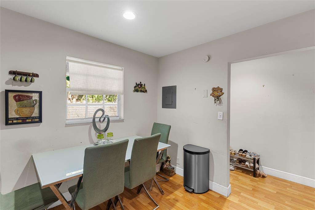 7556 Stirling Road, Unit 222 Hollywood, FL 33024 - Photo 26 of 48 a living room with furniture and a wooden floor