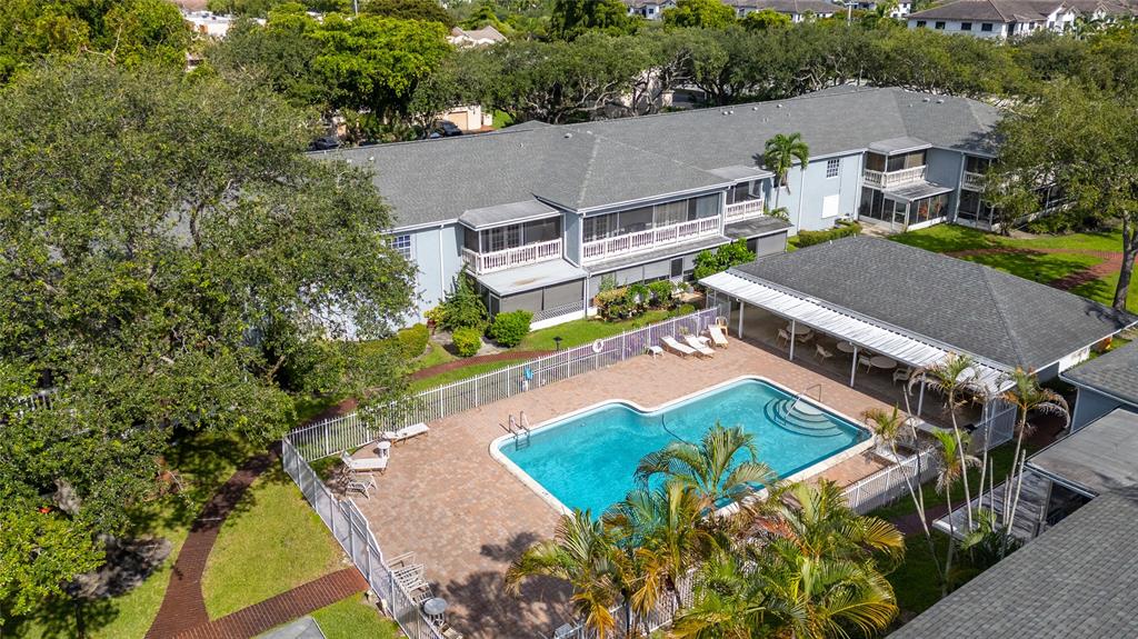 7556 Stirling Road, Unit 222 Hollywood, FL 33024 - Photo 33 of 48 an aerial view of a house with a garden and swimming pool