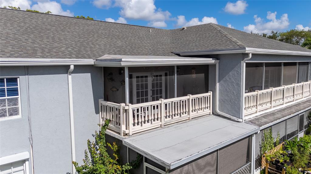 7556 Stirling Road, Unit 222 Hollywood, FL 33024 - Photo 36 of 48 a balcony with a potted plant and outdoor seating