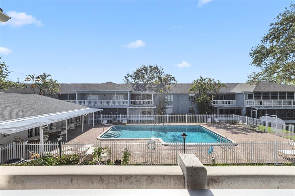 7556 Stirling Road, Unit 222 Hollywood, FL 33024 - Photo 48 of 48 a view of a swimming pool with seating space