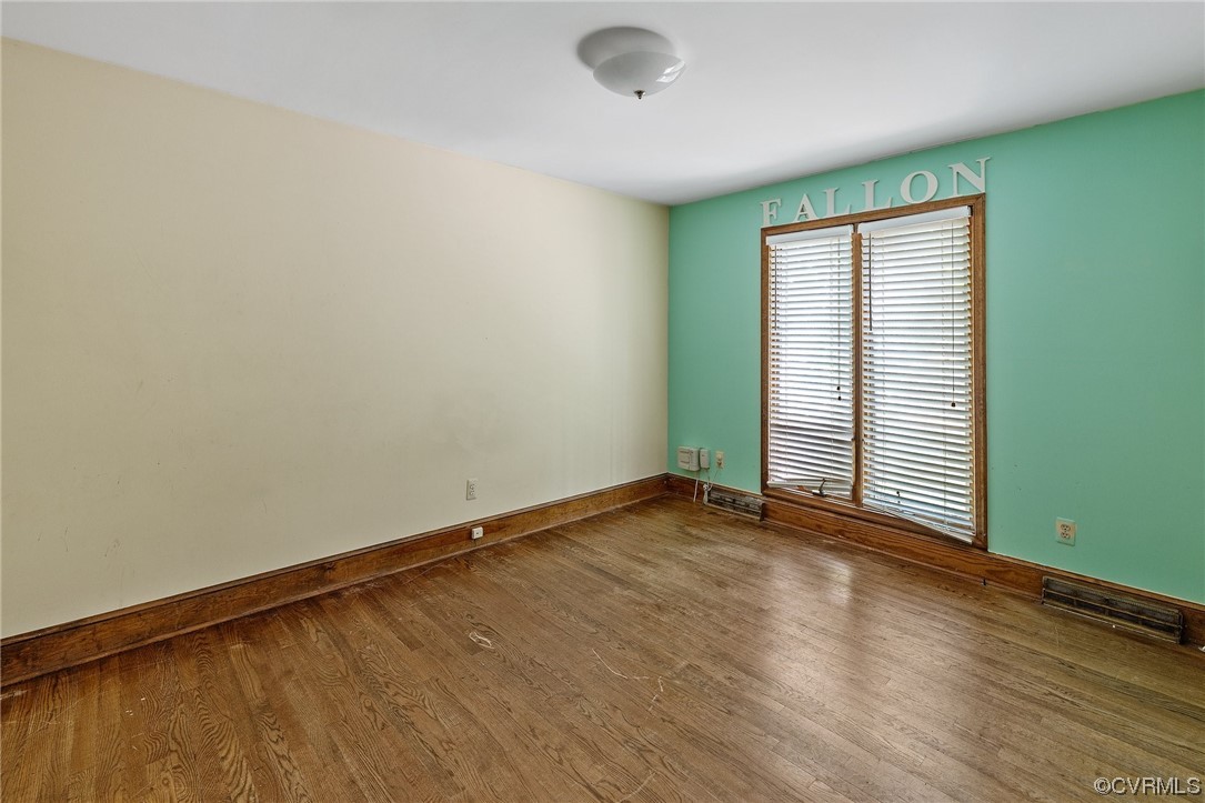 3828 Timber Ridge Road Midlothian, VA 23112 - Photo 14 of 34 an empty room with wooden floor and windows