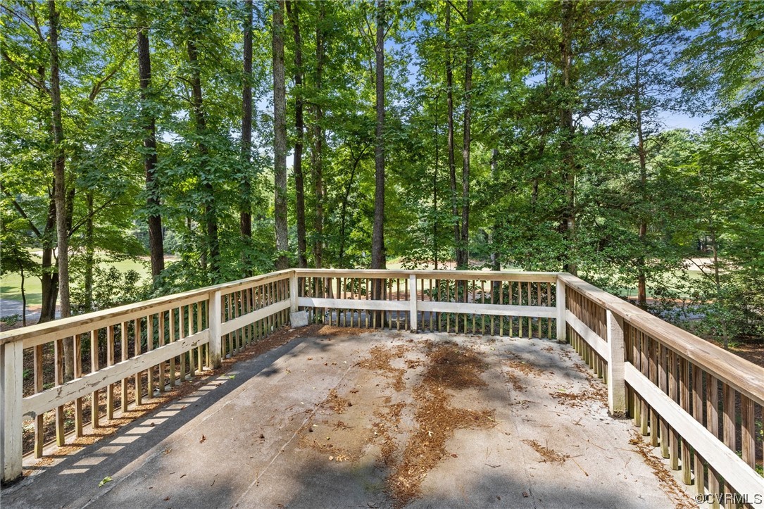 3828 Timber Ridge Road Midlothian, VA 23112 - Photo 20 of 34 a balcony with trees in front of it
