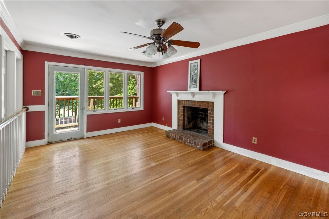 3828 Timber Ridge Road Midlothian, VA 23112 - Photo 22 of 34 a view of empty room with wooden floor and fireplace