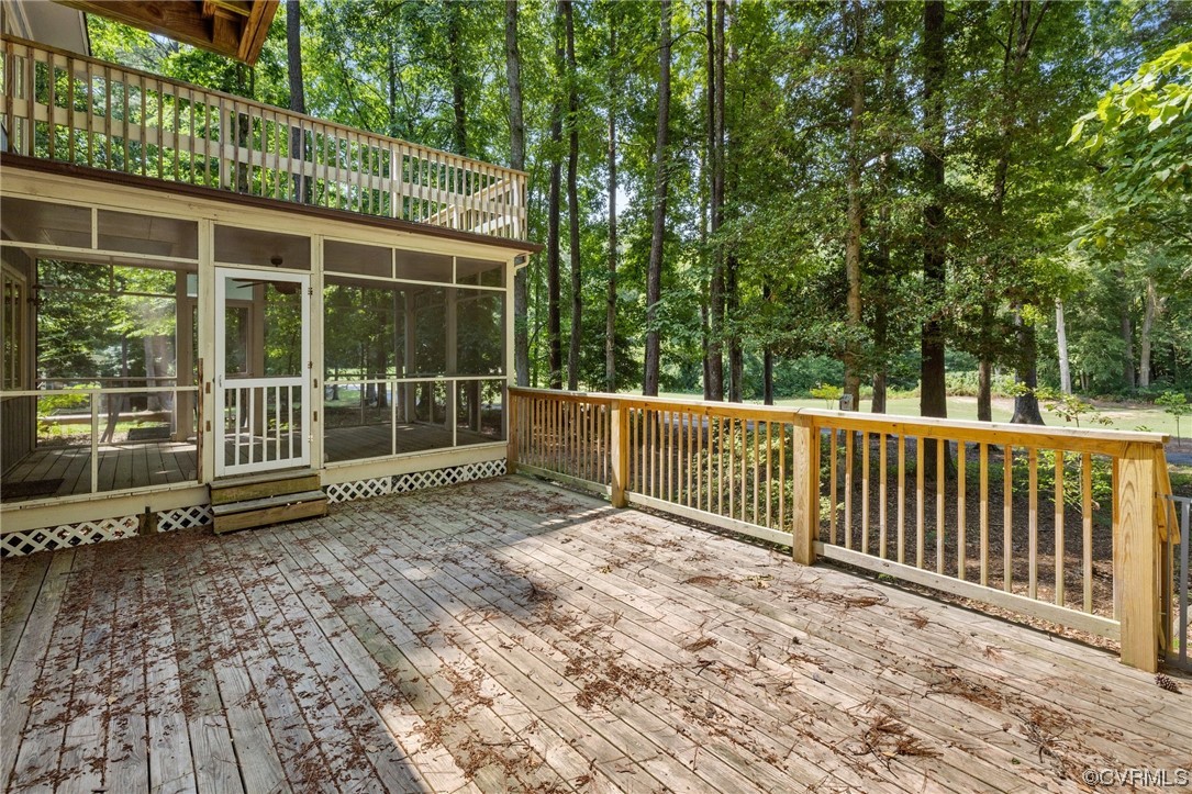 3828 Timber Ridge Road Midlothian, VA 23112 - Photo 33 of 34 a view of a deck with a floor to ceiling window and wooden fence