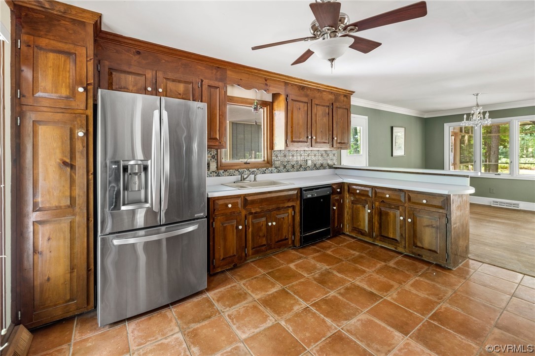 3828 Timber Ridge Road Midlothian, VA 23112 - Photo 4 of 34 a kitchen with stainless steel appliances granite countertop a refrigerator a sink dishwasher a stove with wooden cabinets and floor