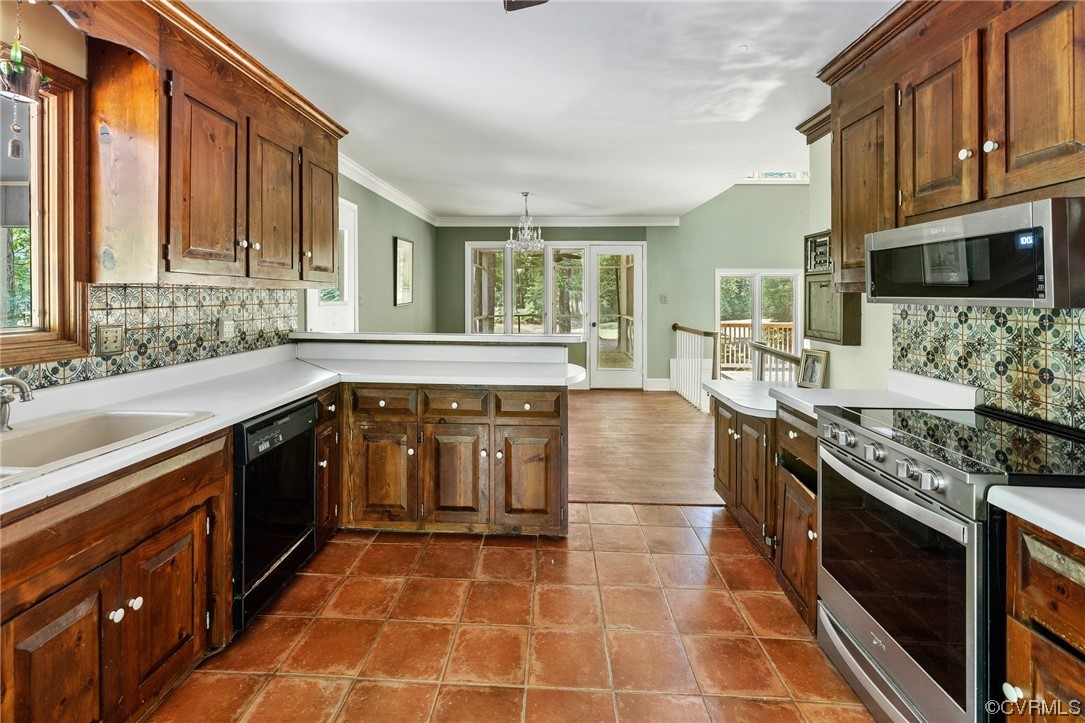 3828 Timber Ridge Road Midlothian, VA 23112 - Photo 5 of 34 a kitchen with stainless steel appliances granite countertop a stove a sink and a microwave