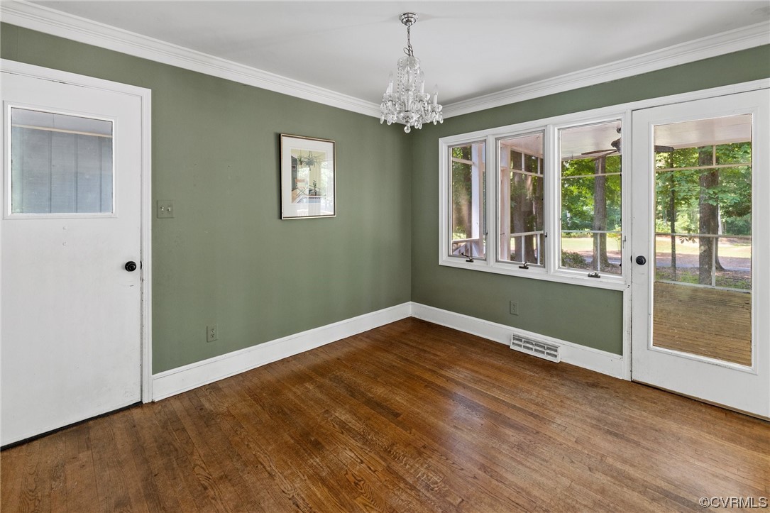 3828 Timber Ridge Road Midlothian, VA 23112 - Photo 8 of 34 a view of an empty room with wooden floor and a window
