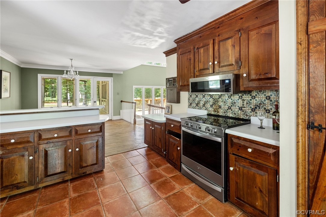 3828 Timber Ridge Road Midlothian, VA 23112 - Photo 10 of 34 a kitchen with stainless steel appliances granite countertop a stove and a sink