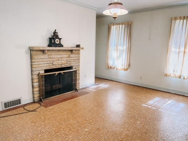 5208 Gwynne Road Memphis, TN 38117 - Photo 7 of 12 an empty room with windows and fireplace