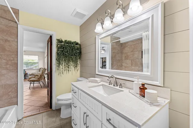 a bathroom with a sink double vanity and a mirror