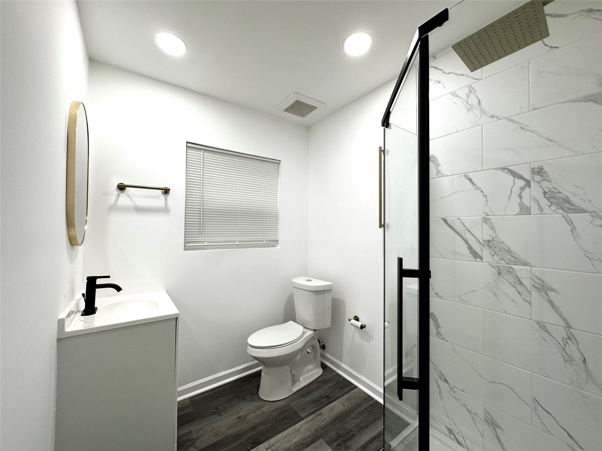 4318 1st Street, Unit C Bacliff, TX 77518 - Photo 10 of 14 a bathroom with a toilet sink and mirror