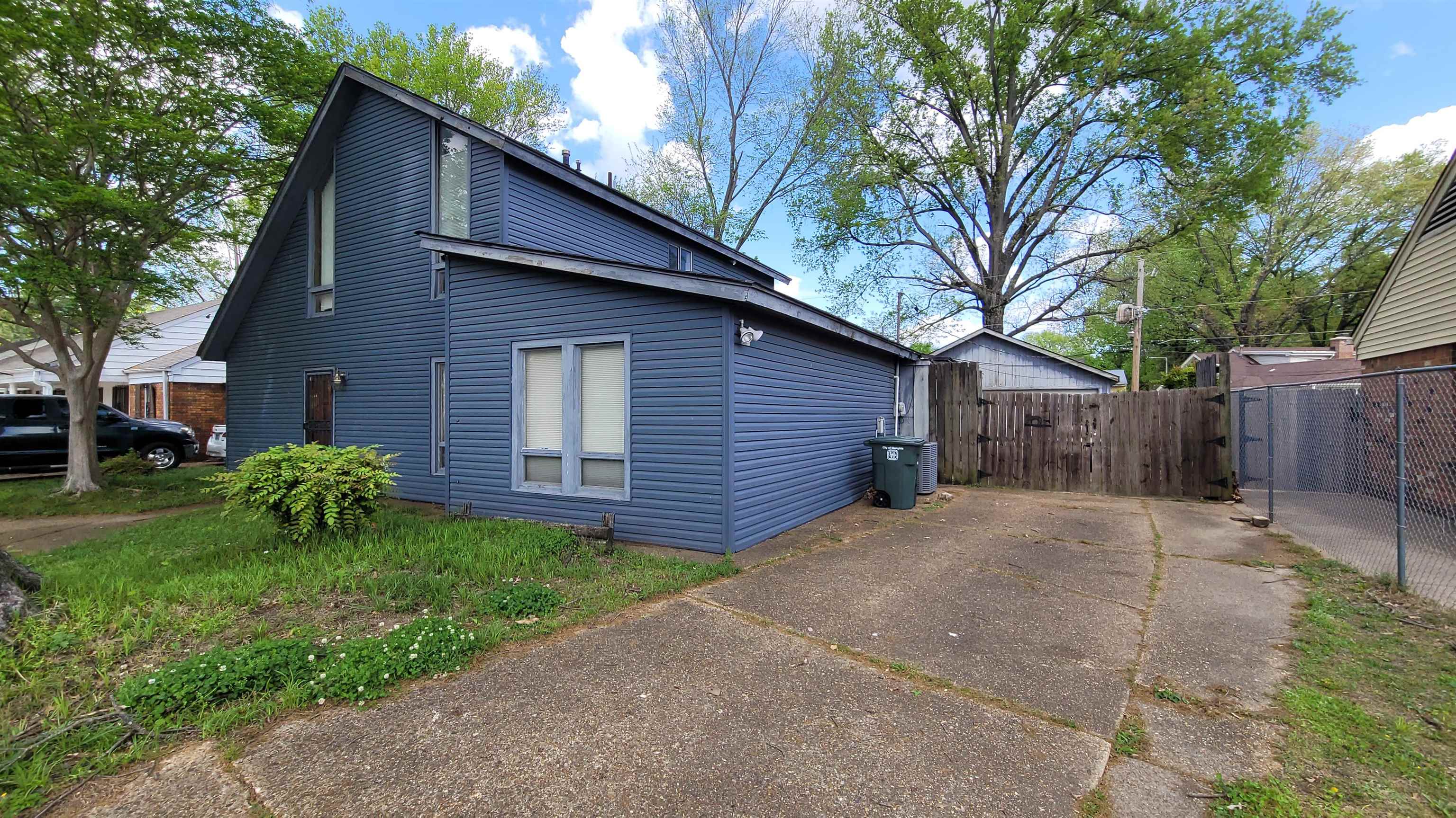 5258 Knight Arnold Road Memphis, TN 38118 - Photo 13 of 13 View of property exterior with fence and concrete driveway