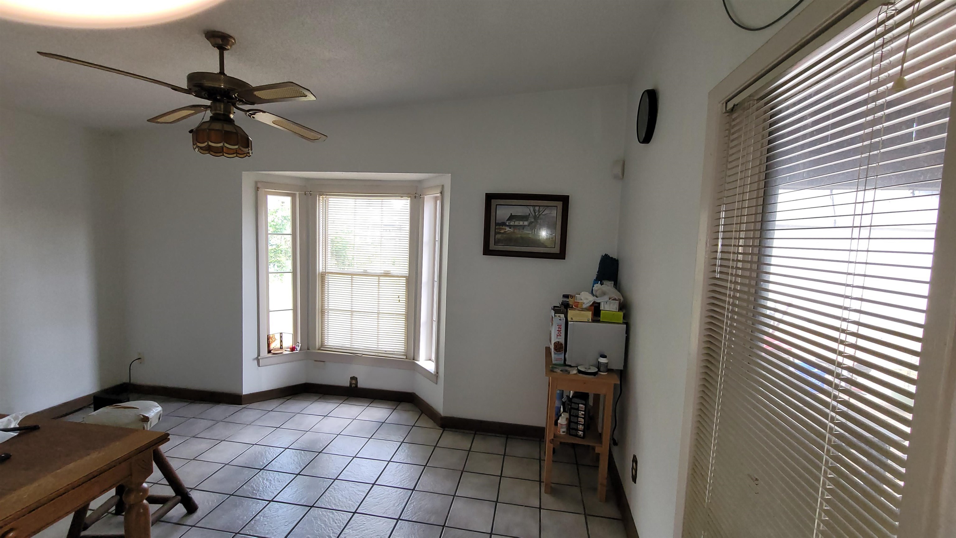 5258 Knight Arnold Road Memphis, TN 38118 - Photo 6 of 13 Interior space featuring light tile patterned floors, ceiling fan, and baseboards