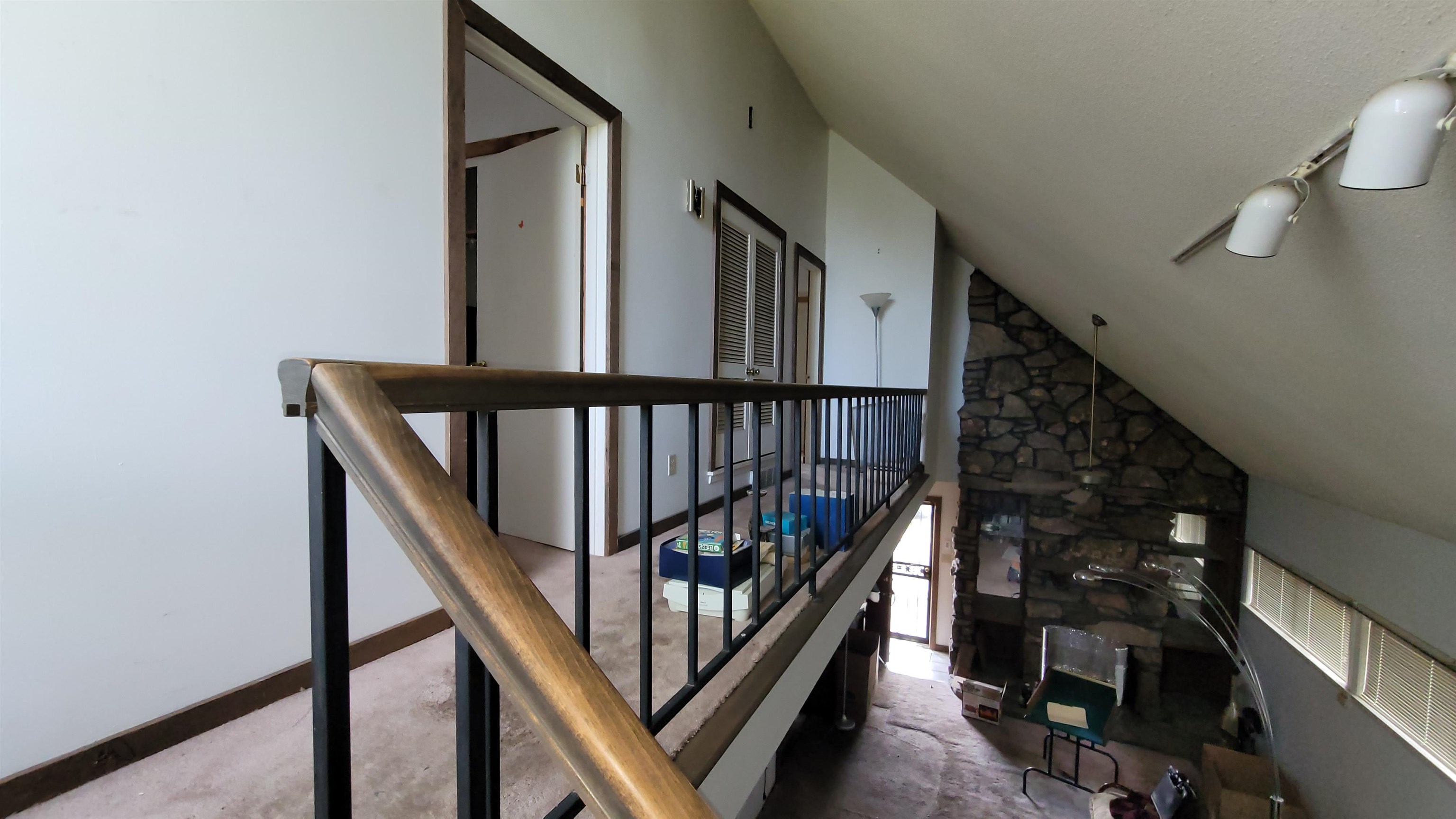 5258 Knight Arnold Road Memphis, TN 38118 - Photo 9 of 13 Stairway featuring carpet and lofted ceiling