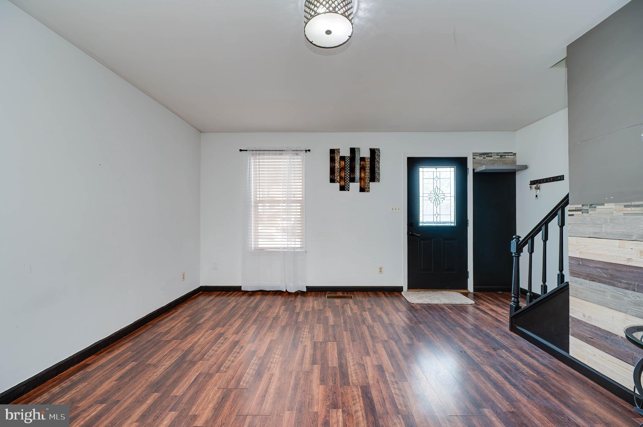 11 Nottingham Court Reading, PA 19601 - Photo 5 of 29 wooden floor in an empty room with a window