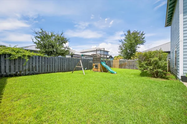 a view of a pathway with a big yard