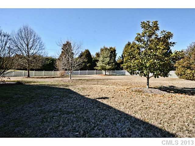 7603 Rathlin Court Charlotte, NC 28270 - Photo 15 of 15 a view of a yard with trees