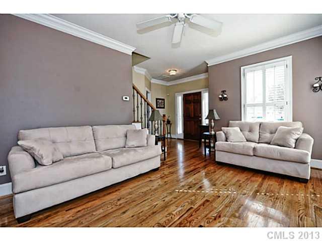 7603 Rathlin Court Charlotte, NC 28270 - Photo 4 of 15 a living room with furniture and a wooden floor