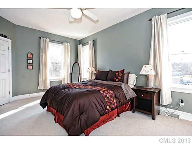 7603 Rathlin Court Charlotte, NC 28270 - Photo 8 of 15 a bedroom with a bed and a window