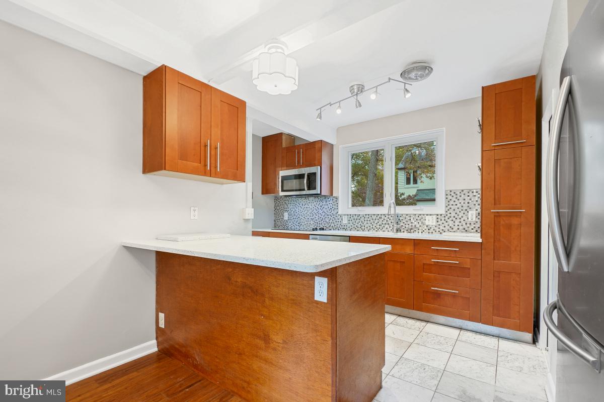 33 Ridge Road Greenbelt, MD 20770 - Photo 11 of 29 a kitchen with stainless steel appliances granite countertop a refrigerator and a sink