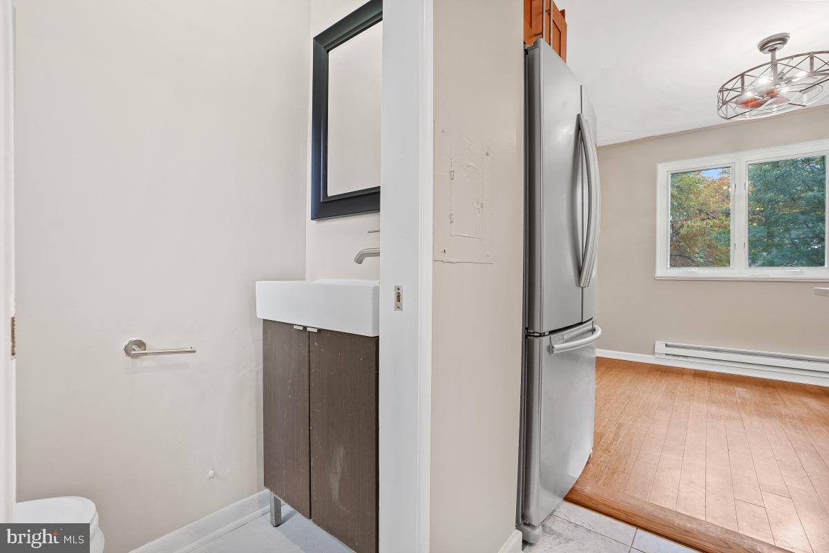 33 Ridge Road Greenbelt, MD 20770 - Photo 14 of 29 a bathroom with a sink and a mirror