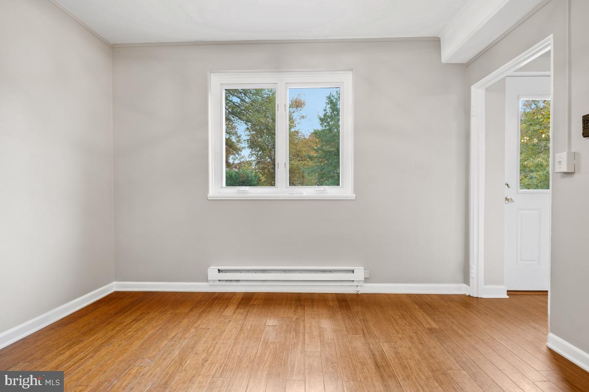 33 Ridge Road Greenbelt, MD 20770 - Photo 15 of 29 a view of a room with wooden floor and window