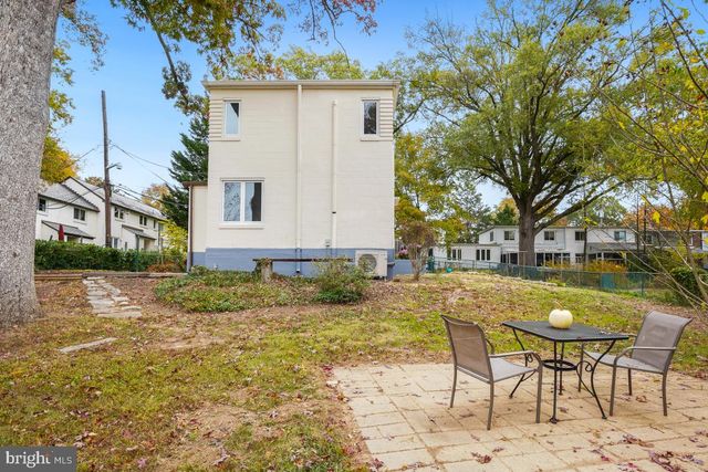 a view of swimming pool with outdoor seating