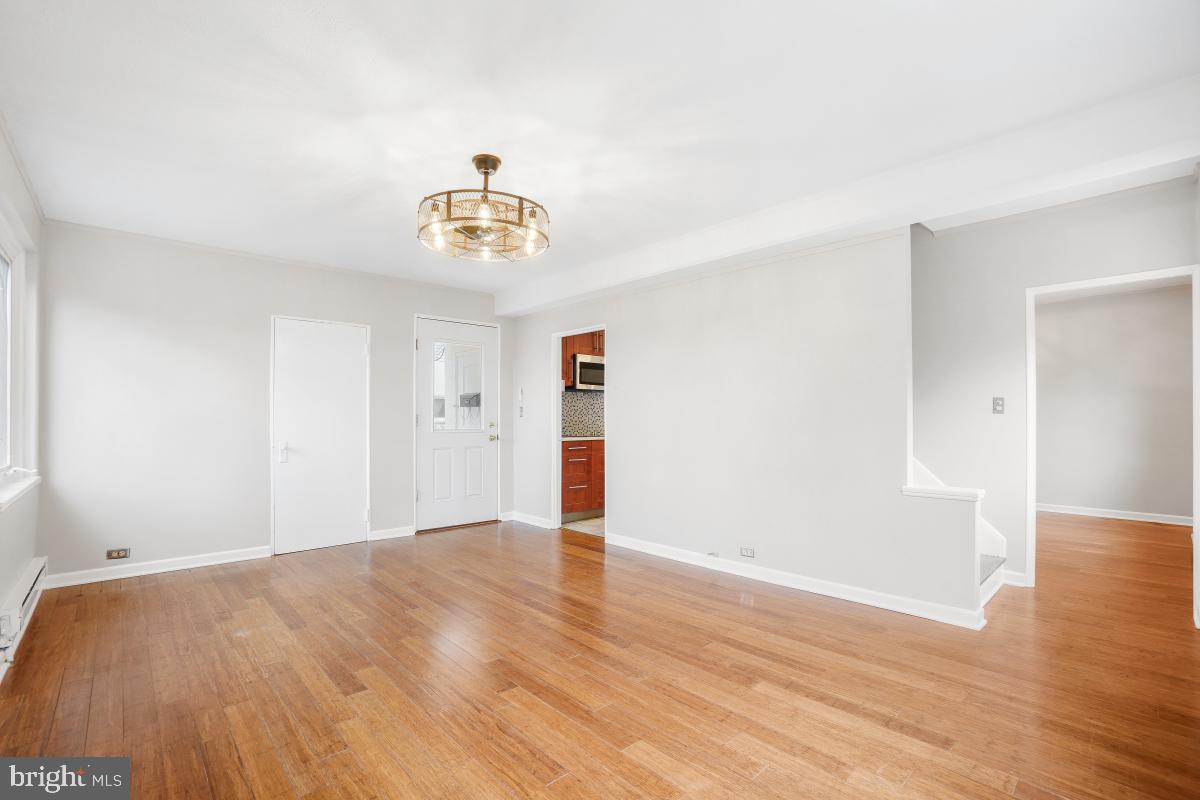 33 Ridge Road Greenbelt, MD 20770 - Photo 5 of 29 a view of an empty room with wooden floor