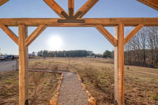 a kitchen with a dining table chairs stainless steel appliances and cabinets