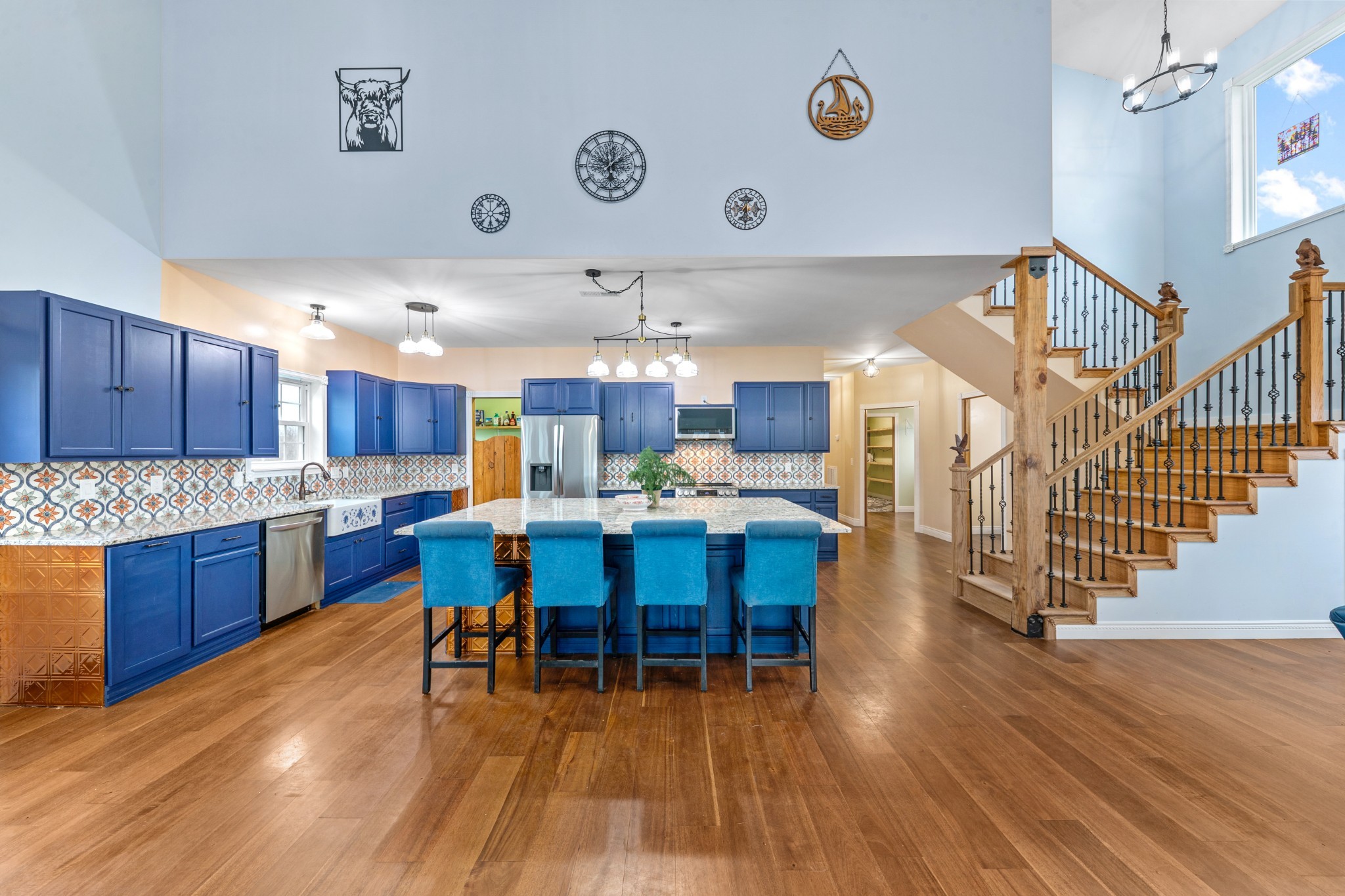 1221 Johnson Branch Road Pulaski, TN 38478 - Photo 22 of 99 a kitchen with stainless steel appliances wooden floor dining table chairs and wooden floor