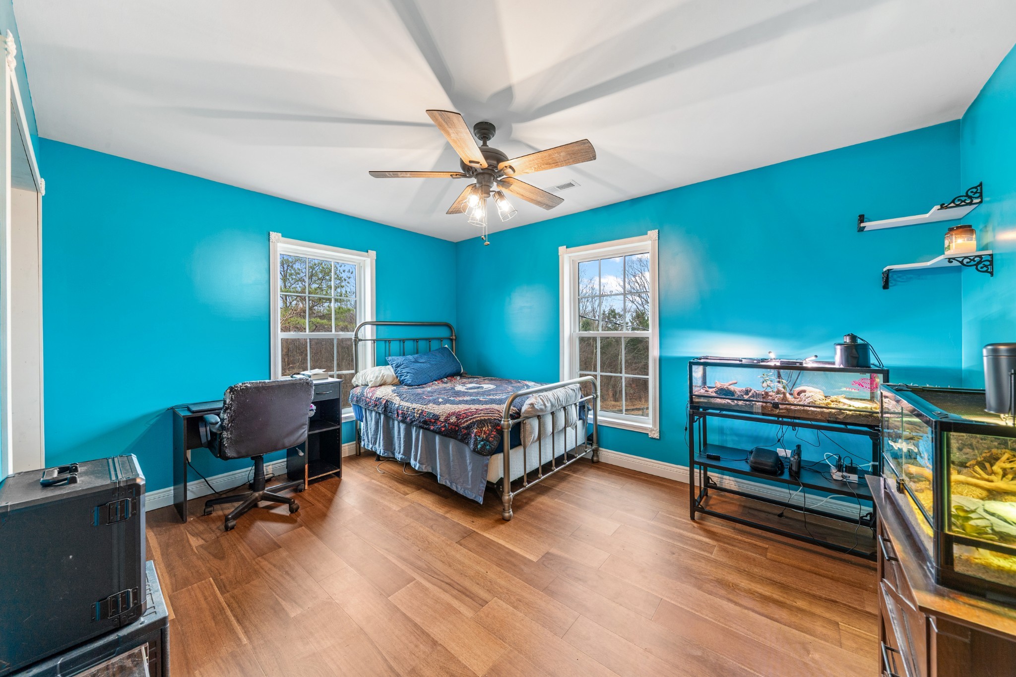 1221 Johnson Branch Road Pulaski, TN 38478 - Photo 47 of 99 a bedroom with a bed and a chandelier