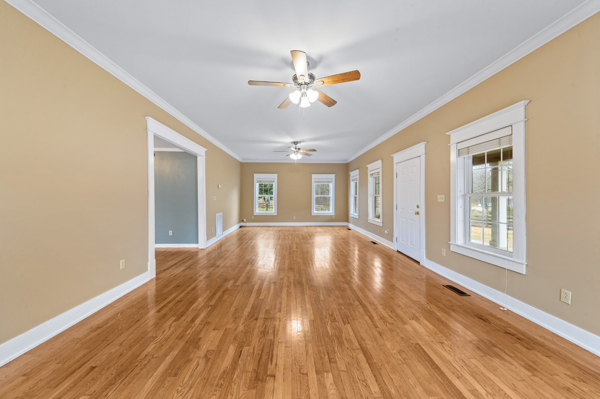 1221 Johnson Branch Road Pulaski, TN 38478 - Photo 62 of 99 a view of an empty room with wooden floor and a window
