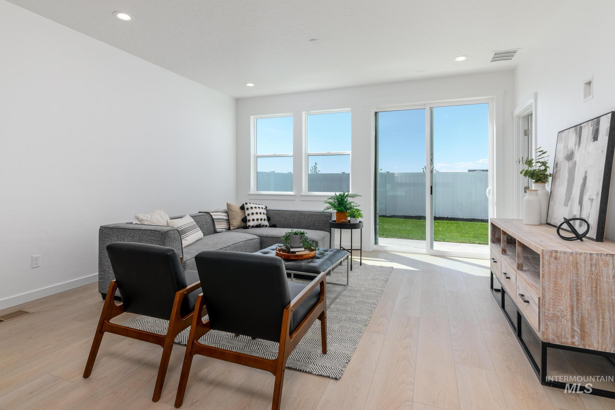 14742 Wing Spread Drive Caldwell, ID 83607 - Photo 2 of 10 Living area featuring light wood-type flooring and recessed lighting