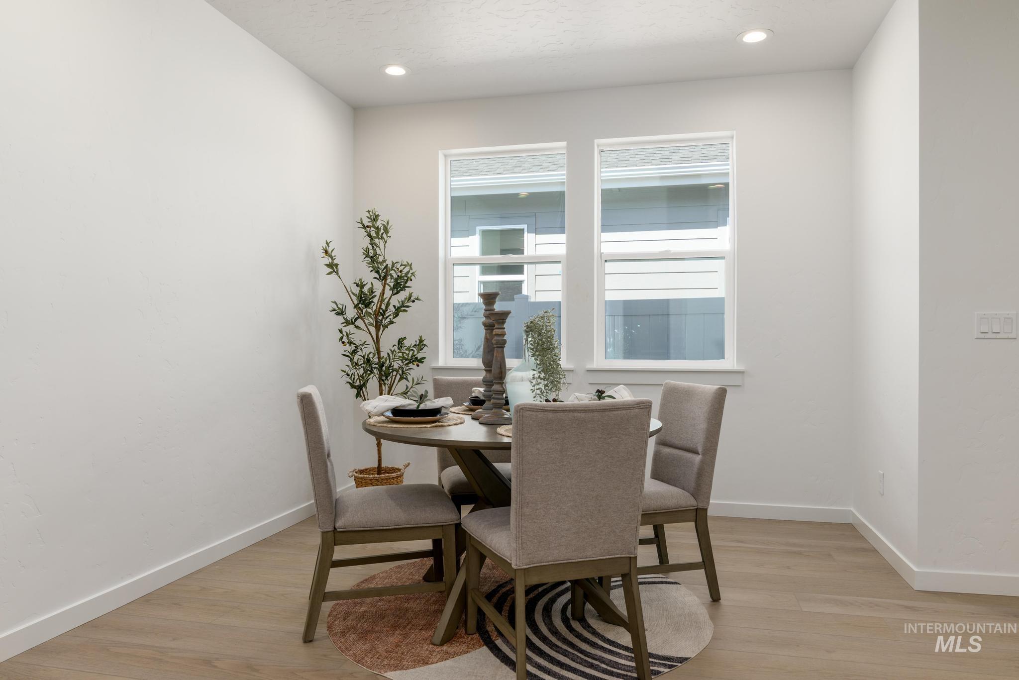 14742 Wing Spread Drive Caldwell, ID 83607 - Photo 7 of 10 Dining room featuring light wood-style flooring and recessed lighting