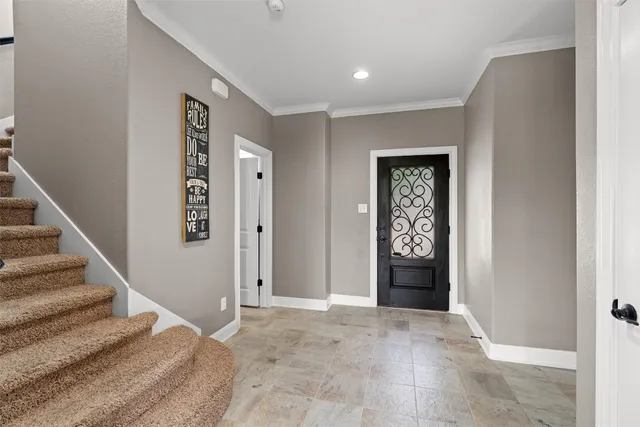 a view of an entryway with wooden floor