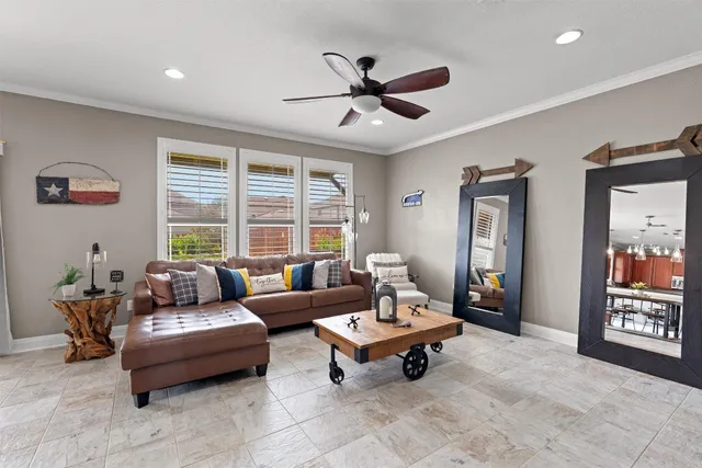 a living room with furniture and a large window
