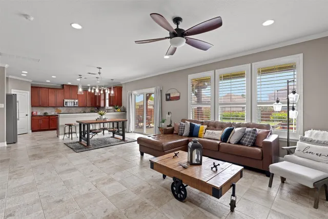 a living room with furniture and a large window