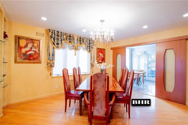 a dining room with furniture and wooden floor