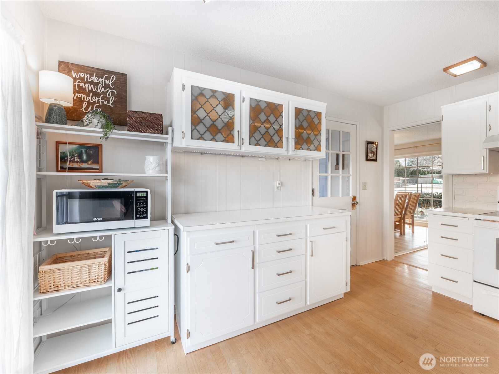 934 Stevens Street Wenatchee, WA 98801 - Photo 13 of 39 a kitchen with stainless steel appliances cabinets and wooden floor