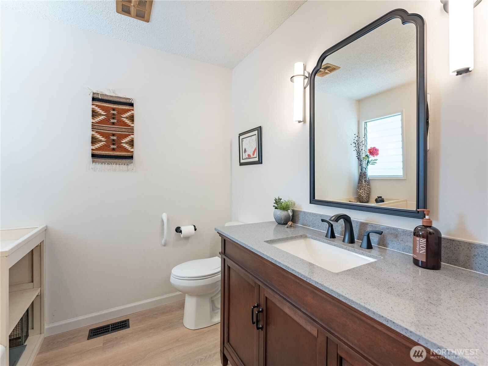 934 Stevens Street Wenatchee, WA 98801 - Photo 23 of 39 a bathroom with a granite countertop sink toilet and mirror