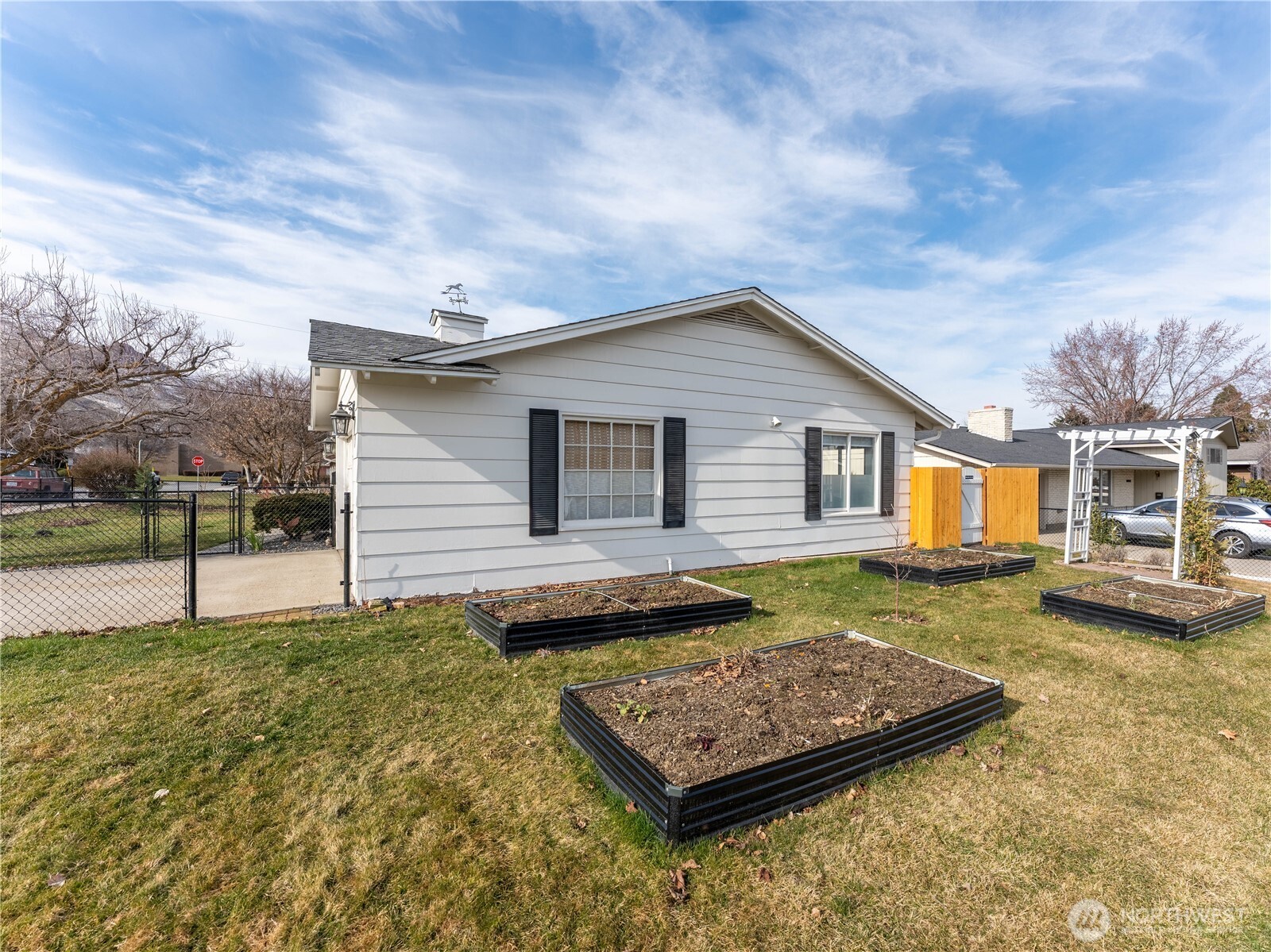 934 Stevens Street Wenatchee, WA 98801 - Photo 28 of 39 a view of a house with a yard and sitting area