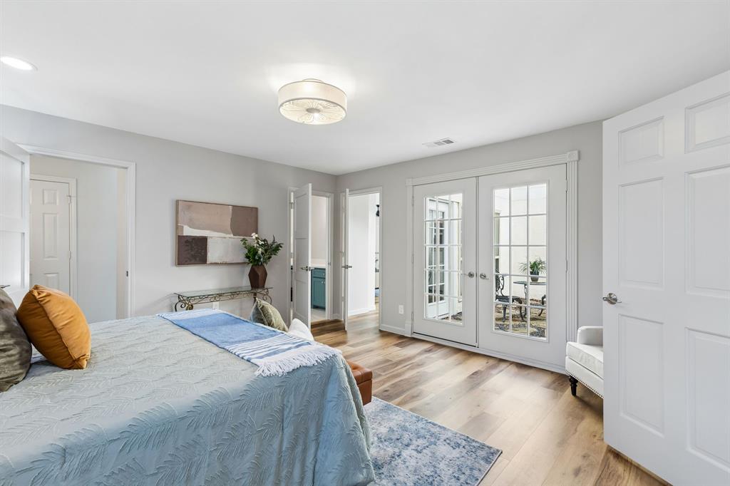 8115 Old Moss Road Dallas, TX 75231 - Photo 15 of 25 Large Primary Bedroom with sitting area and courtyard entrance