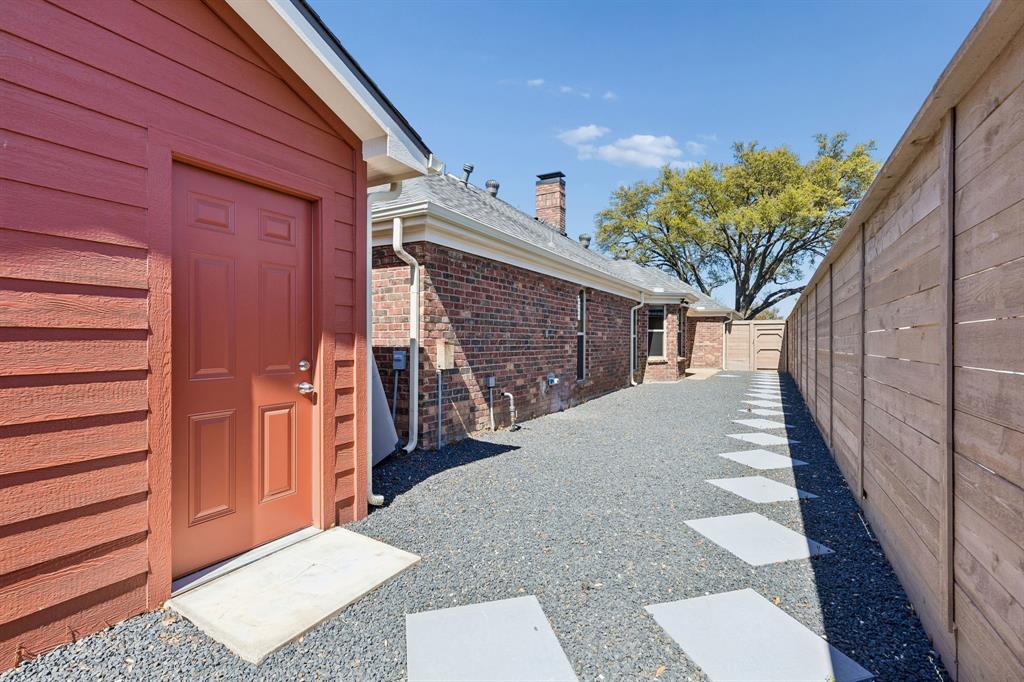 8115 Old Moss Road Dallas, TX 75231 - Photo 23 of 25 Side yard with door to garage.