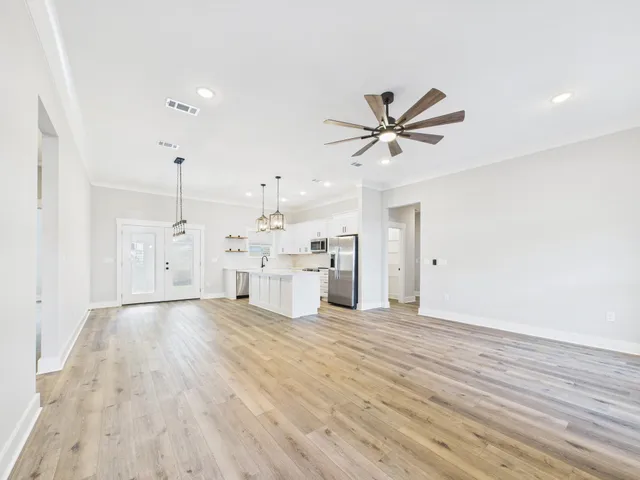 a view of a livingroom with a kitchen