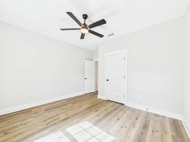 a view of a small space with wooden floor and small space