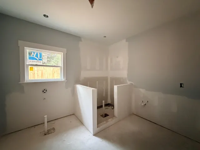 a view of cabinets and utility room