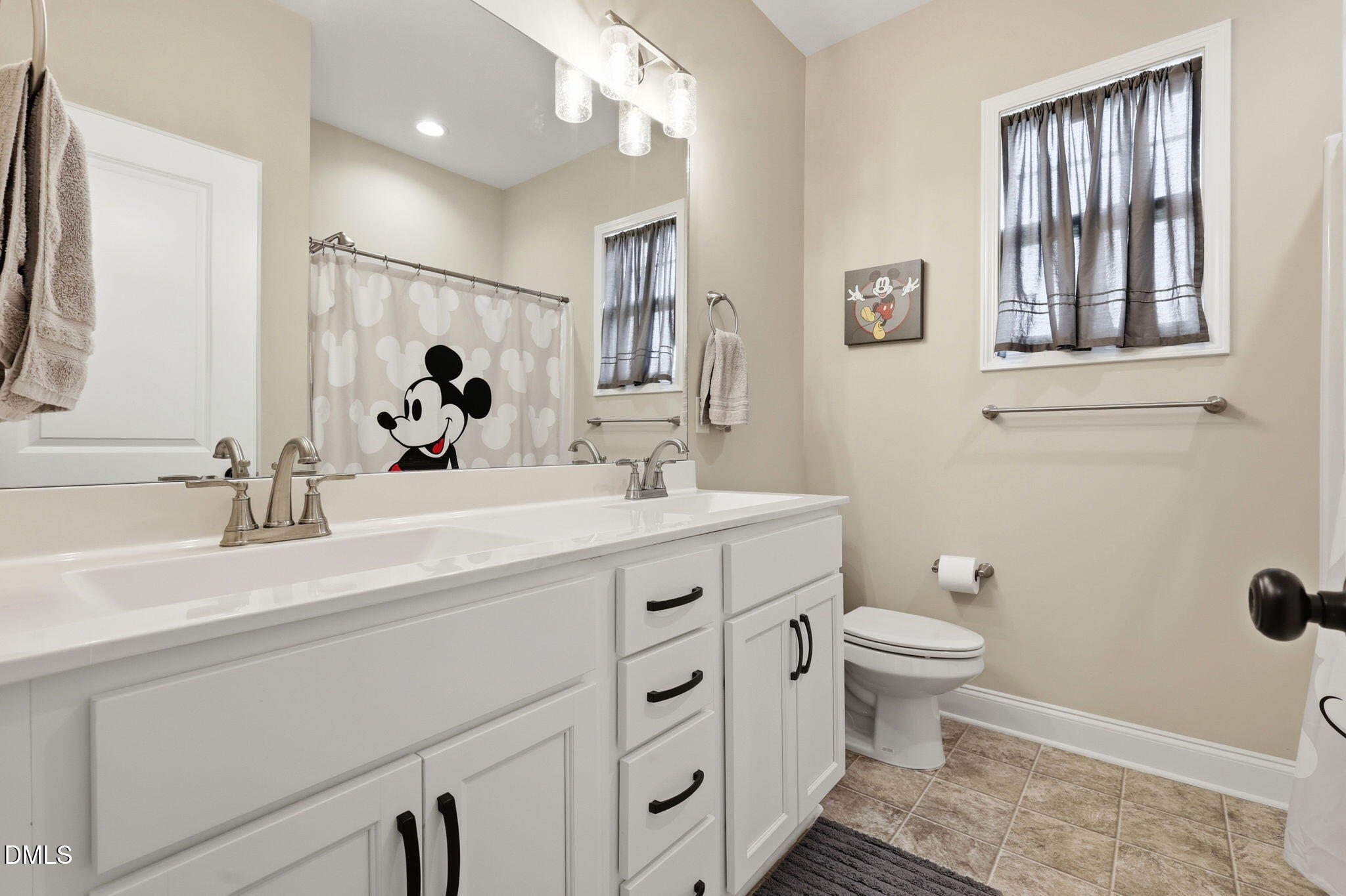 5098 Spring Hill Church Road Lillington, NC 27546 - Photo 22 of 36 a bathroom with a double vanity sink mirror and toilet