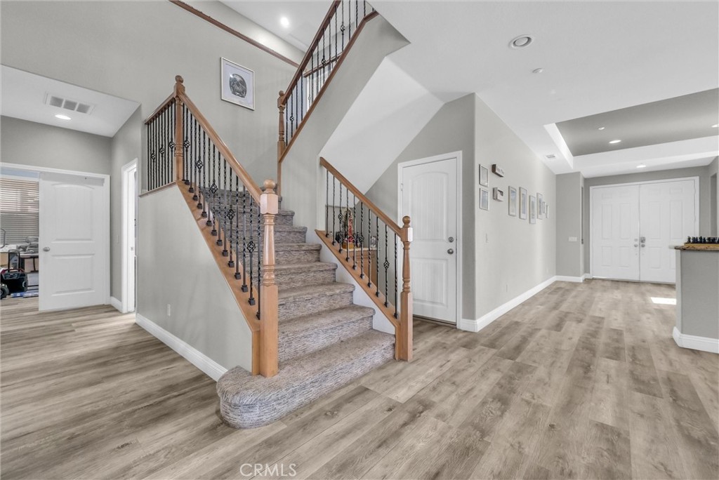 18388 Hidden Ranch Road Riverside, CA 92508 - Photo 16 of 49 a view of entryway and hall with wooden floor