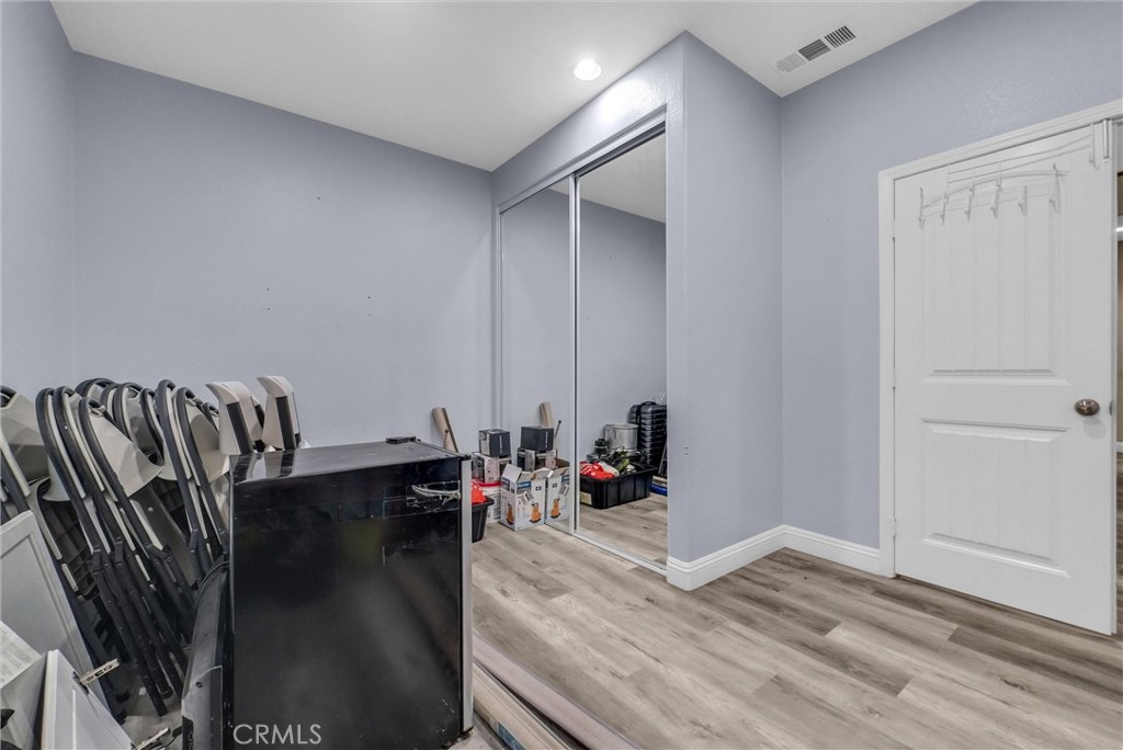 18388 Hidden Ranch Road Riverside, CA 92508 - Photo 19 of 49 a view of a room with wooden floor and furniture